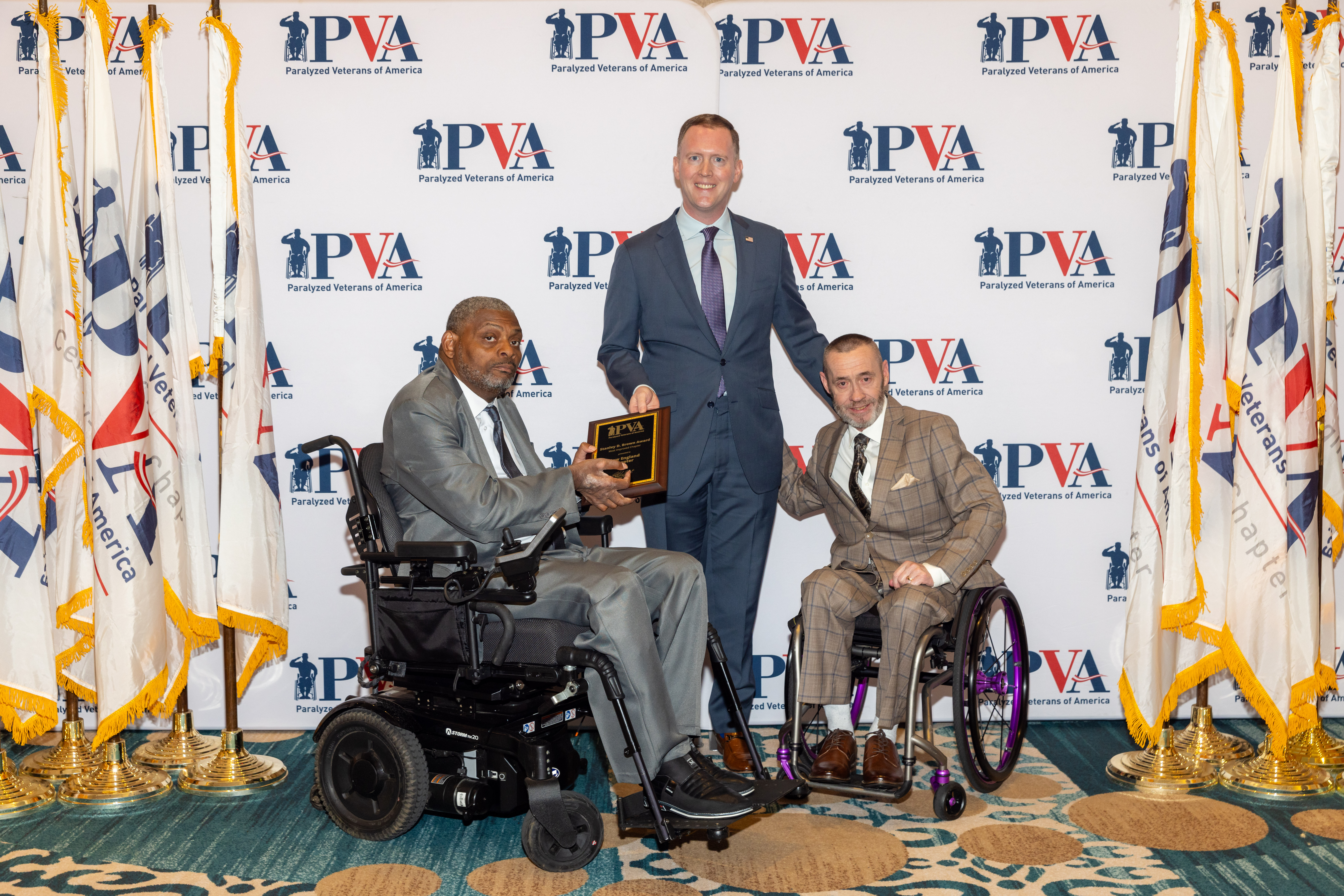 Robert Thomas, President of PVA presents Mark and Brad the Stanley D. Brown most improved Chapter award.