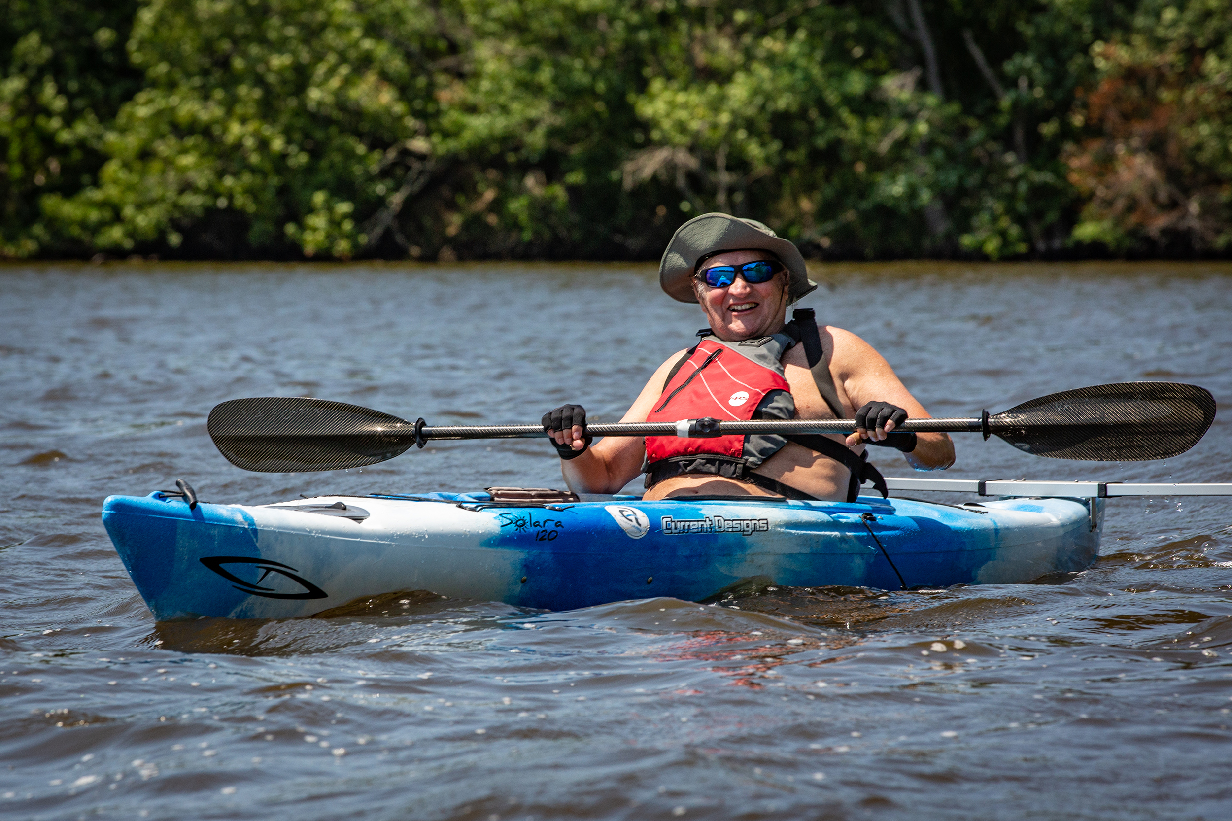 Disabled veteran paddling a kayak.