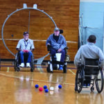 Veterans using wheelchairs to play Boccia
